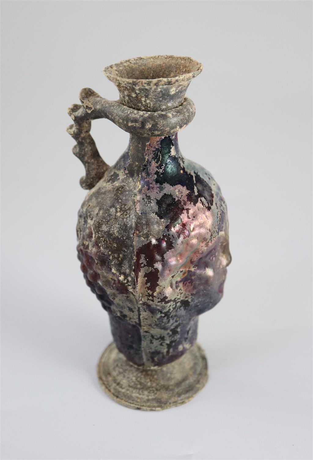 A Roman amethyst glass ewer, 1st/2nd century AD, 15.2cm high